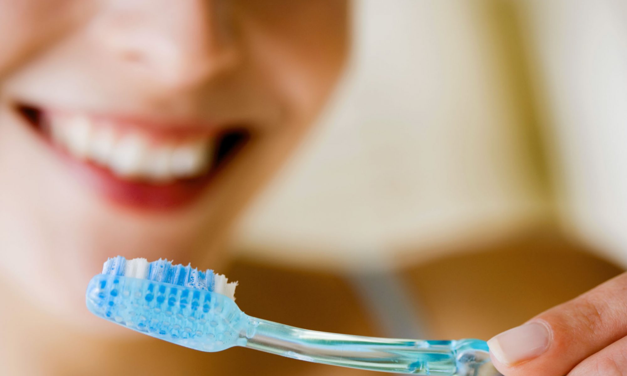 woman brushing teeth